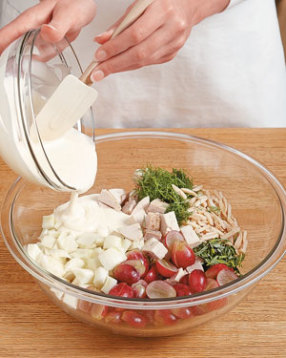 Add the dressing into the bowl of salad ingredients, and gently mix until thoroughly coated.