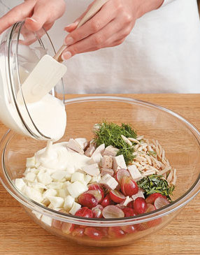 Add the dressing into the bowl of salad ingredients, and gently mix until thoroughly coated.