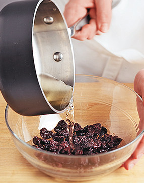 Pour heated vinegar over the dried cherries to soften and plump them, and to enhance their tartness.
