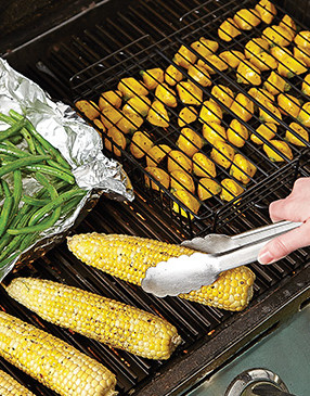 Corn is easy to grill, but grill smaller vegetables that might fall through the grate in grill baskets or on foil.