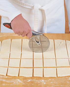 Cutting the dough into similar-sized pieces ensures they'll cook evenly and in the same amount of time.