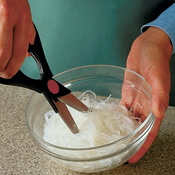 Kitchen shears make short work of cutting the softened noodles. Simply snip the noodles into short pieces.