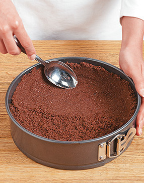 Press crust mixture on the bottom and up the sides of a springform pan with the back of a spoon.