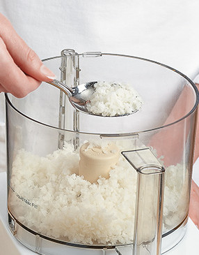 Use a food processor to mince some of the coconut. The fine texture helps bind the cookies together.