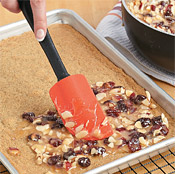 Scoop all of the filling onto the crust, spread it evenly, and bake the bars for 15 minutes.