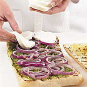 Separate grilled onion into rings and layer over pesto on ciabatta. Top onion rings with slices of mozzarella.