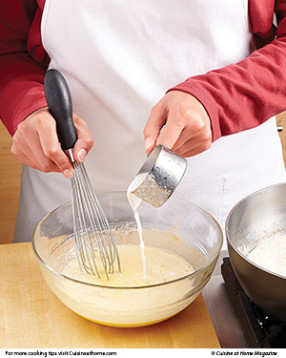 To prevent the eggs from curdling, temper the yolk mixture, drizzling in the hot cream while whisking.
