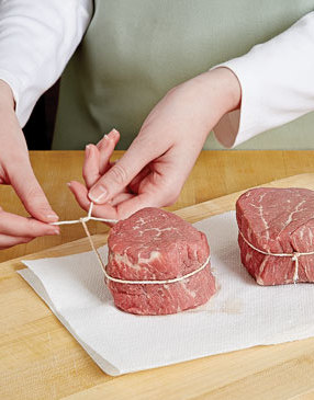 Tying the filets helps them hold their shape as they cook. Trim the ends of the string before cooking filets, then snip off before serving.