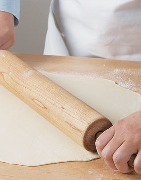 On a lightly floured work area, roll dough from the center to the edge to form a 10- to 12-inch circle. 