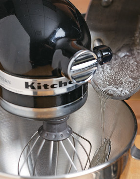 To prevent sugar bits, slowly drizzle syrup down the side of the mixer bowl with the machine running.
