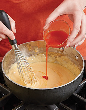 While the sauce is boiling, whisk in Frank’s hot sauce for the quintessential Buffalo flavor. 
