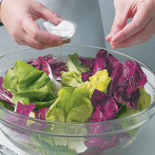 If desired, sprinkle a little kosher salt over the clean lettuce leaves. Salt accentuates the flavor of each type of lettuce, and brings out the sweetness of the dressing and fruit. 