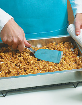 To spread cereal mixture evenly on bars, coat the back of a metal spatula with nonstick spray, then use it to press the topping onto the bars. 