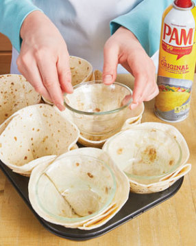 Custard cups hold the pleated tortillas in place. Coat bottoms with nonstick spray so they don’t stick.