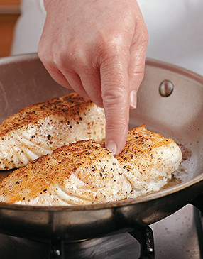 Press the fillet with your finger or a spatula &mdash; if it flakes easily and does not fall apart, it's done.