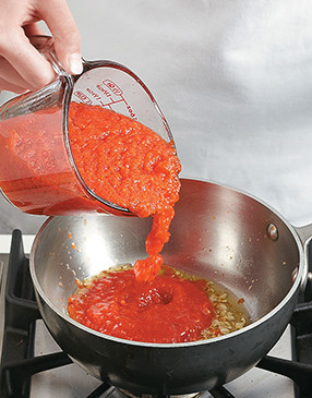 To thicken the sauce, add the pepper mixture to the garlic oil and simmer briefly to cook out excess liquid.
