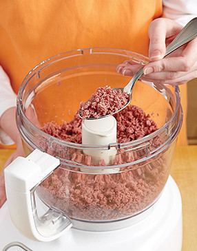 So the pieces distribute evenly in the batter, pulse diced corned beef in a food processor until minced.