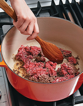 Use a wooden spoon to break up the large chunks while browning the meat to avoid clumping.