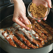 Just before bacon is finished, sprinkle with sugar until melted. Be careful not to burn.