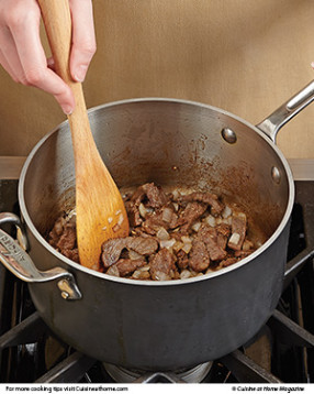 After browning the steak, add the onion so it softens and absorbs some of that beefy flavor.