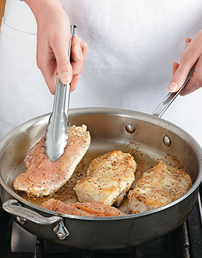 Brown chicken breasts in a hot pan and scrape up browned bits on the bottom to add flavor to the fajitas.