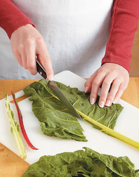 Cut away the chard stems and ribs so you’re left with tender, leafy leaves that are easy to cut through.
