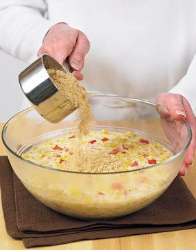 Add the cracker crumbs and stir to combine. The crumbs will help bind the ingredients and add flavor.