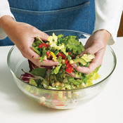 Toss salad and sliced chicken with vinaigrette, then serve with croutons.