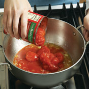 Include the juice from the can. It will boost the soup&rsquo;s flavor. Lightly crush tomatoes with a spoon.