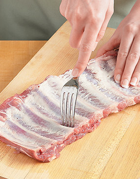 To help the rub penetrate the meat, "dock" the ribs by inserting a fork between the bones.