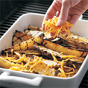 The residual heat from the grill melts the cheese on the fries, but close the lid to retain the heat until ready to serve.