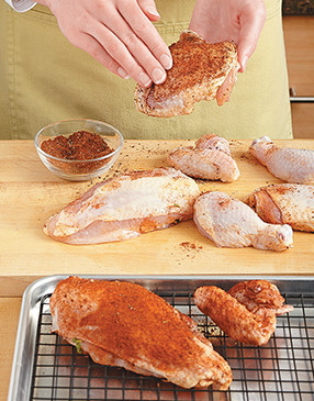 There's no need to oil the chicken. The cinnamon-spice rub will stick just fine to the brined skin.