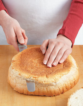 For flat grilling surfaces, use a serrated knife to trim the top and bottom crusts off of the bread.