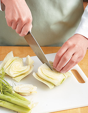 Cut stalks from the fennel bulb. Trim root end from bulb, then halve bulb and core it before dicing.