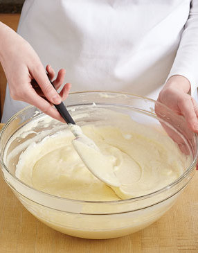 Use an over-under motion to fold the egg whites into the batter without deflating them too much.