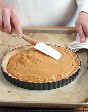 Add filling to the <i>hot</i> crust so it begins to firm up immediately instead of soaking into the crust.