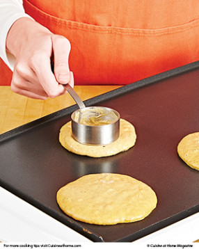 To be sure the pancakes cook all the way through, gently spread the thick batter out on the griddle.
