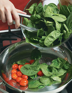 Sauté the tomatoes first, then add the spinach and toss it until it wilts, 2–3 minutes.