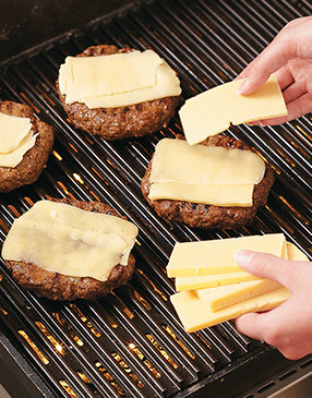 Layer two good melting cheeses &mdash; sharp Cheddar and Chihuahua &mdash; on the burgers for extra flavor.