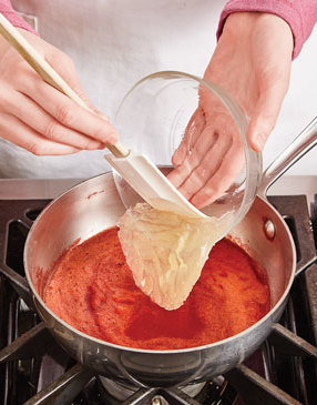 Adding gelatin to the strawberry purée helps it set up and create a firm, clean layer of topping.