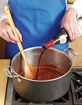 You'll need a whole bottle of wine to ensure the beef is covered. This way the beef won't dry out, plus the wine adds flavor.