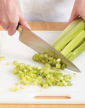 Slice from the top of celery to add some of the leaves to the soup &mdash; they'll add mildly sweet and bitter flavor.