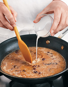 Add cornstarch mixture to liquid in the skillet. Simmer, stirring constantly, until sauce thickens.