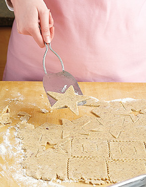 Use a very thin spatula to transfer cut out cookies onto prepared baking sheets.
