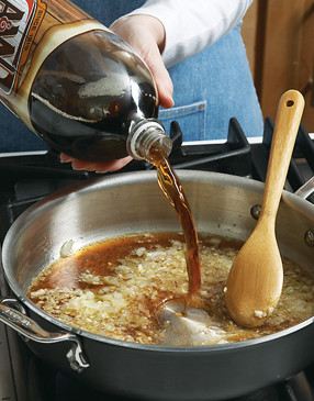 Add 2 cups root beer and reduce until it's syrup-like. Keep an eye on it &mdash; it can burn quickly.
