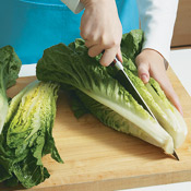 Rinse the romaine, then remove any wilted outer leaves from the heads and slice them in half lengthwise.