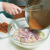 Pour the sauce mixture over the cabbage and onion; toss until evenly coated. 