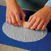 Rolling the rice paper on a wet towel prevents the roll from slipping as you work.