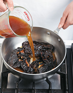 Soaking dried chiles in warm or hot broth softens their flesh so they can easily be pur&eacute;ed for the chili.
