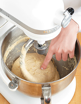Dough should spring back when pressed with a fingertip after kneading with the dough hook.